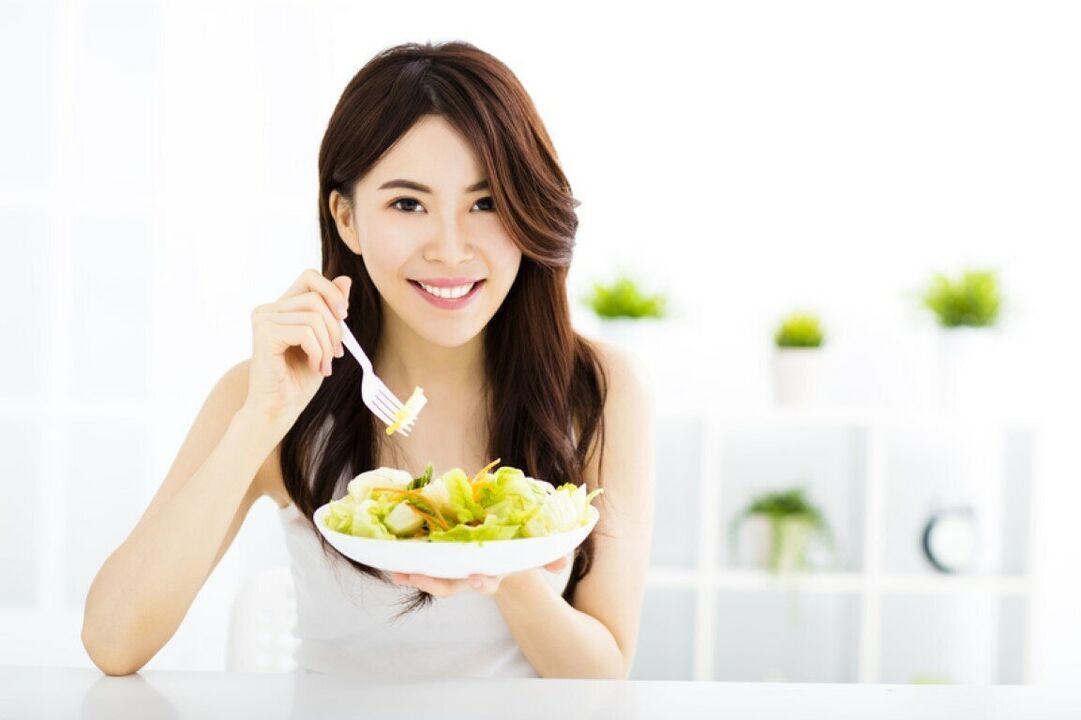 Japanese female eats salad